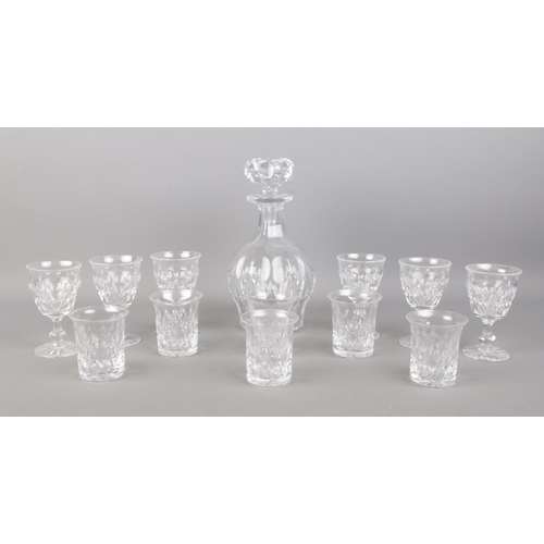 493 - A Tudor cut crystal decanter, together with two sets of six glasses, sherry and whisky.