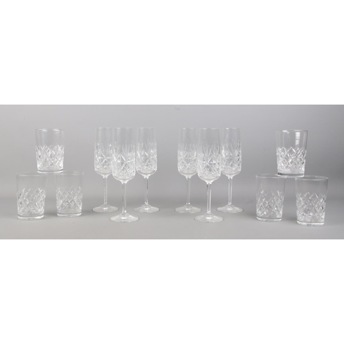 495 - Two sets of six cut crystal glasses; Edinburgh International champagne flutes and Webb tumblers.