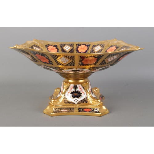 496 - A Royal Crown Derby centerpiece tazza, decorated in the 1128 Old Imari pattern on quatrefoil dolphin... 