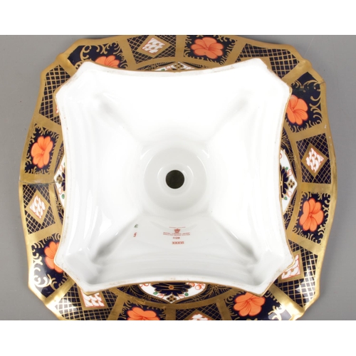 496 - A Royal Crown Derby centerpiece tazza, decorated in the 1128 Old Imari pattern on quatrefoil dolphin... 