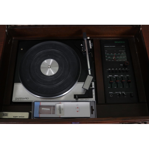 508 - A mahogany cased Dynatron RG 1210 PK radiogram, fitted with Garrard SP25 Mk IV turntable and a colle... 