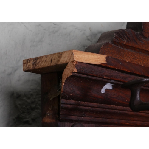 511 - An extensively carved oak hall stand. Featuring central bevel edged mirror and storage box situated ... 