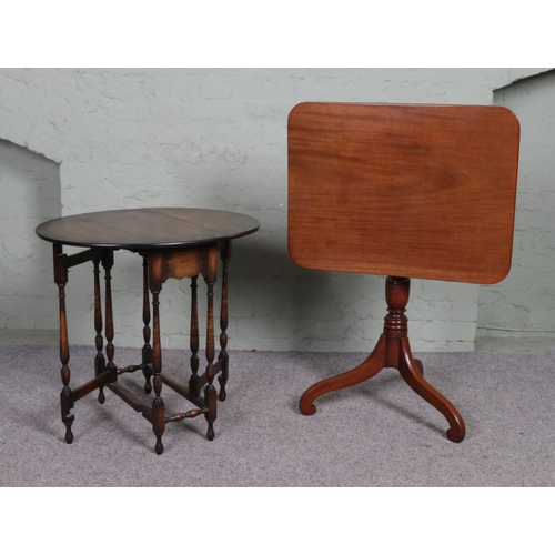 515 - A small tilt top table on tripod base together with a mahogany drop leaf gate leg table with bobbin ... 