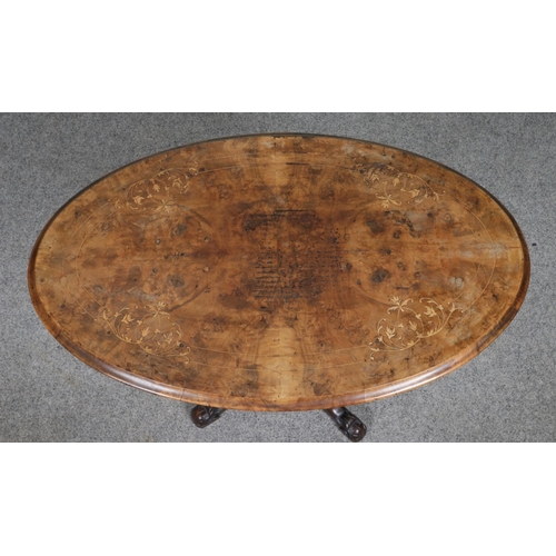 517 - A Victorian inlaid walnut oval side table, with decorative central bobbin pillar, raised on carved c... 