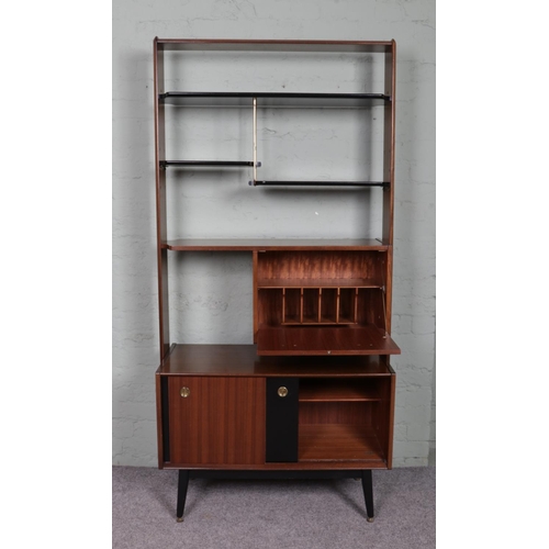 520 - A retro G-Plan E.Gomme room divider unit; containing ebonised shelving, drop down cupboard door and ... 