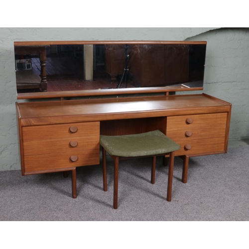 521 - A mid Twentieth Century White and Newton teak dressing table, with stool. Featuring a full length mi... 