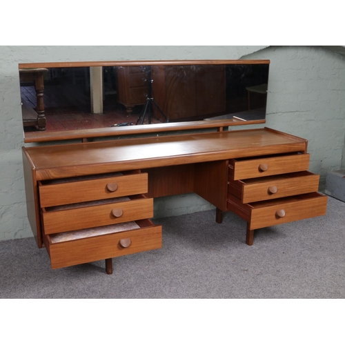 521 - A mid Twentieth Century White and Newton teak dressing table, with stool. Featuring a full length mi... 