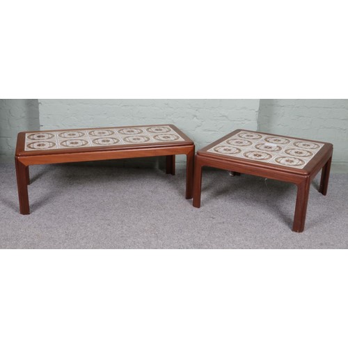 557 - Two tile top low coffee tables.