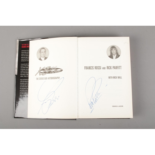 50 - Status Quo signed hardback book titled \XS all areas signatures on the inside page include Rick Parf... 