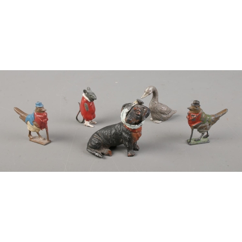 483 - Britains Cadbury Cococubs lead advertising figures together with a small pewter goose and a cold pai... 