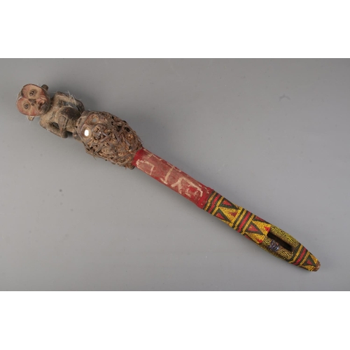 490 - A Yoruba tribal wooden carved scepter with a carved kneeling man and bound mud packed shrunken head ... 