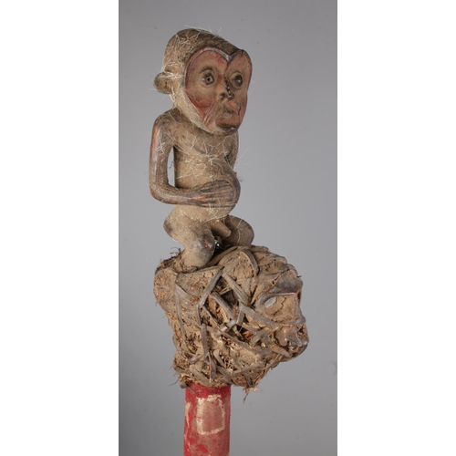 490 - A Yoruba tribal wooden carved scepter with a carved kneeling man and bound mud packed shrunken head ... 