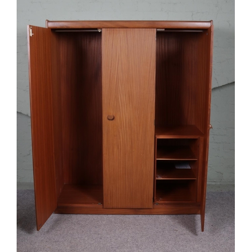 525 - A three door White & Newton Selbourne wardrobe with three shelves and a rail to the interior. 173cm ... 