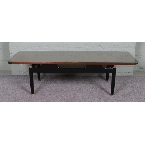 529 - A G Plan E Gomme long teak and ebonised coffee table with glass top. 


Hx40cm
Wx137cm
Dx50cm