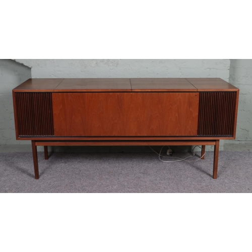 533 - A Mid century teak cased radiogram with Garrard AT6 turntable and Beomaster 900 stereo including a s... 