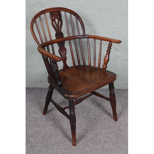 546 - A 19th century ash and elm Windsor chair.