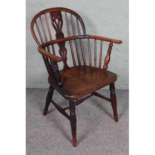 546 - A 19th century ash and elm Windsor chair.