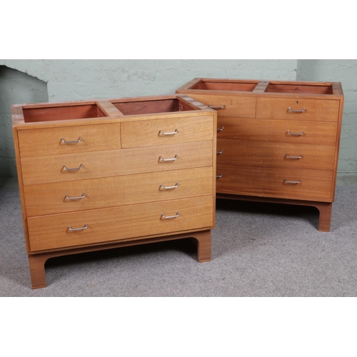 549 - A pair of mid 20th century teak MOD military chest of drawers. With a configuration of two over thre... 