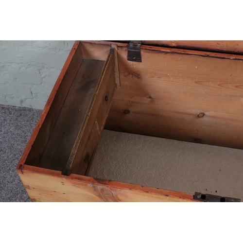 552 - An antique pine blanket box with internal candle box with drawers.