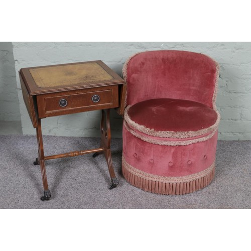 545 - A small bedroom chair in pink velvet upholstery with a sofa style table with leather inset top