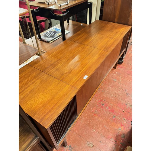 533 - A Mid century teak cased radiogram with Garrard AT6 turntable and Beomaster 900 stereo including a s... 