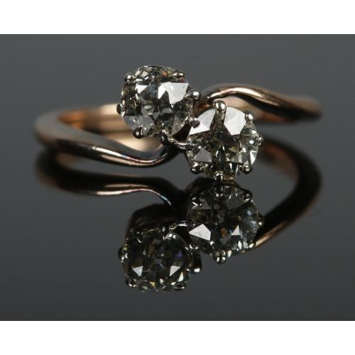 101 - An antique 18ct gold two stone diamond/Toi et Moi ring. Both old cut stones approximately 0.5ct each... 