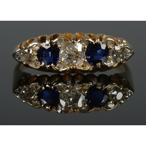 102 - An early 20th century 18ct yellow gold, diamond and sapphire five stone ring. Central diamond approx... 