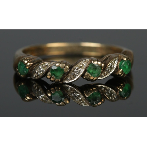 103 - A 9ct yellow gold emerald and diamond ring. Size L. 1.92g.