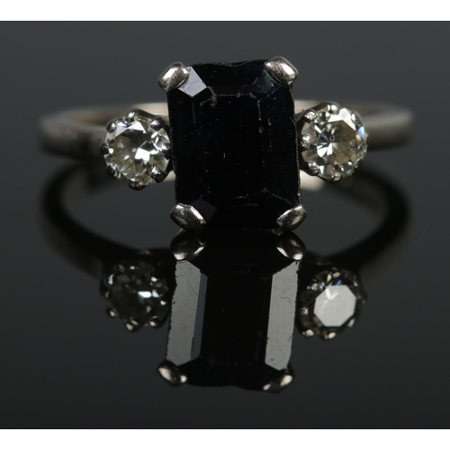 107 - An 18ct white gold sapphire and diamond ring. Cushion cut sapphire approximately 1cm x 0.7cm. Size P... 