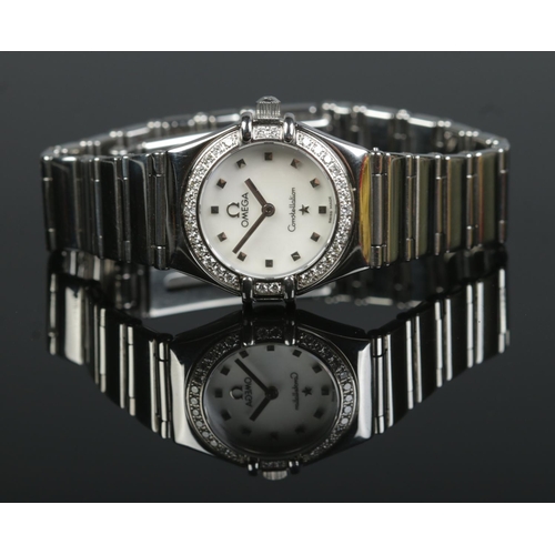 110 - A ladies stainless steel Omega Constellation wristwatch. The bezel set with approximately 0.33ct of ... 