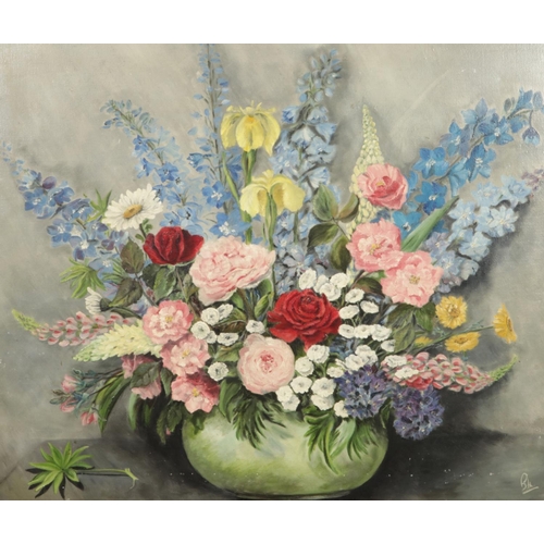 123 - A large unframed oil on canvas, still life with flowers. Initialled to bottom right. 63cm x 76cm.