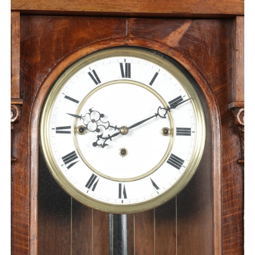 127 - A 19th century walnut cased triple weight Vienna wall clock. Length 132cm.