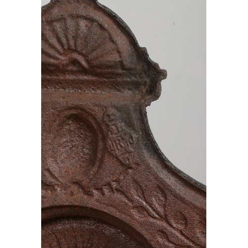 132 - A Victorian cast iron fire grate with sun motif. Bearing date lozenge to back. Width of back plate 4... 