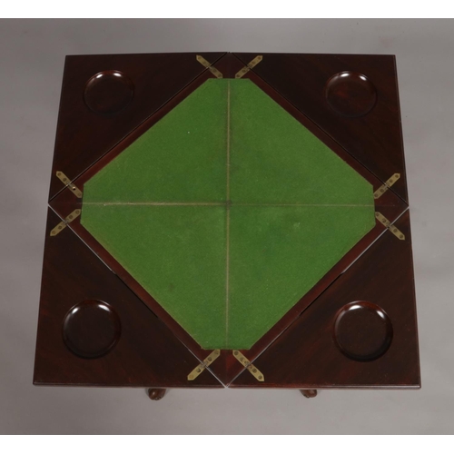 141 - A late Victorian mahogany envelope games table. Raised on cabriole supports.