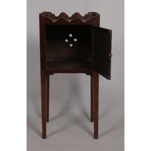 144 - An late Georgian mahogany pot cupboard raised on square cut legs. Height 76cm.