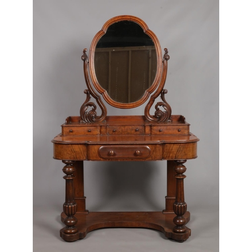 145 - A Victorian walnut Duchess dressing table.