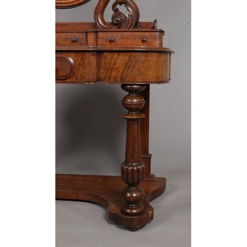 145 - A Victorian walnut Duchess dressing table.