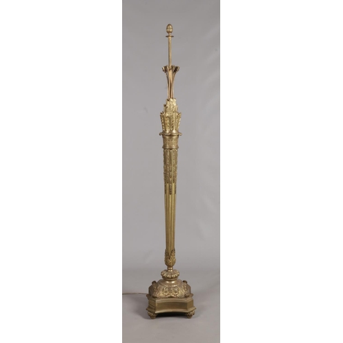 147 - An Ormolu standard lamp with acanthus leaf and feather decoration and acorn finial. Height 198cm.