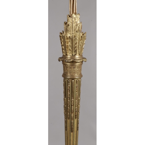 147 - An Ormolu standard lamp with acanthus leaf and feather decoration and acorn finial. Height 198cm.