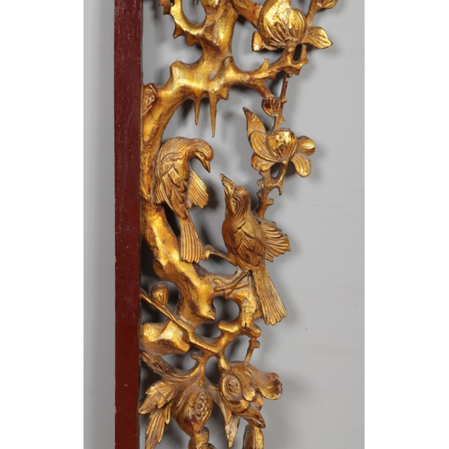 148 - A large late 19th/early 20th century gilt carved wood archway/frieze depicting basket of pomegranate... 