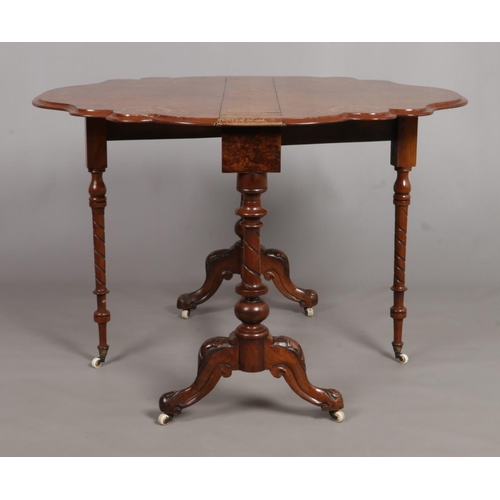 149 - A Victorian walnut Sutherland table with marquetry inlaid decoration. Top 105cm x 92cm.