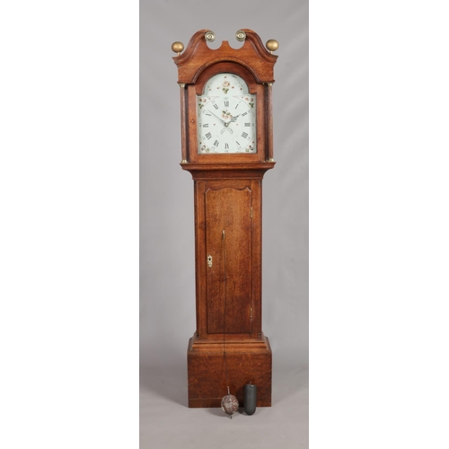 153 - A Georgian oak 30 hour long case clock. With twin swan neck pediment, painted dial, Roman numeral ho... 