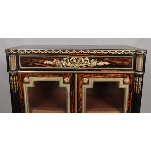 154 - A 19th century coromandel pier cabinet with gilt metal mounts. Ebonised to side and top with satinwo... 