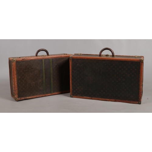 158 - Two vintage graduated Louis Vuitton Alzer trunk suitcases. Both bearing the matching Serial Number 0... 