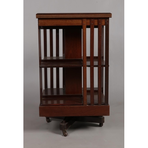 160 - An Edwardian mahogany revolving bookcase. Having marquetry and ivory inlaid decoration. Height 89cm,... 