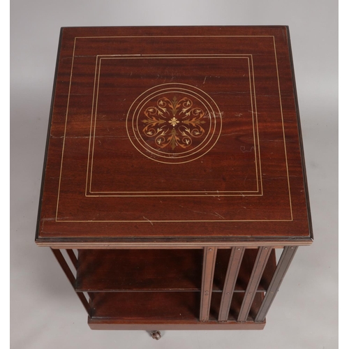 160 - An Edwardian mahogany revolving bookcase. Having marquetry and ivory inlaid decoration. Height 89cm,... 