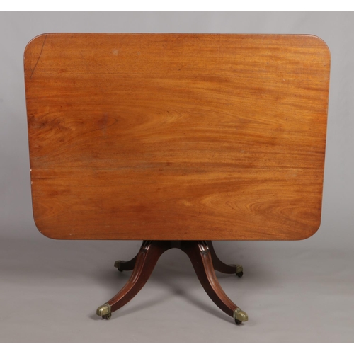 161 - A Regency mahogany tilt top breakfast table. Table top 126cm x 89cm.