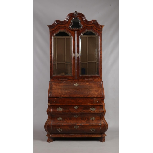 166 - A 19th century Dutch walnut bureau bookcase. With mirrored top and fitted interior.