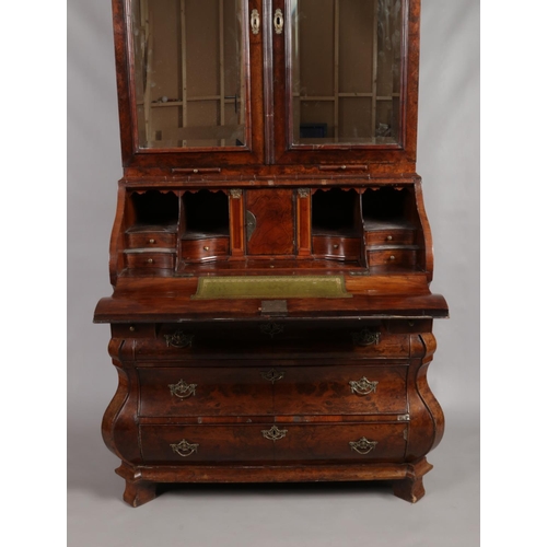 166 - A 19th century Dutch walnut bureau bookcase. With mirrored top and fitted interior.