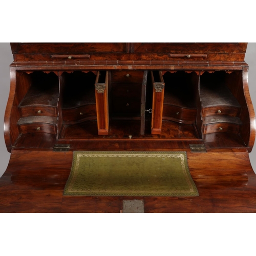 166 - A 19th century Dutch walnut bureau bookcase. With mirrored top and fitted interior.